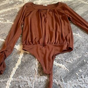 Free people rust bodysuit size S, excellent condition